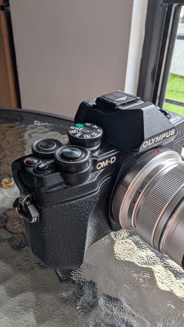 Olympus OM-D E-M10 Mark III Mirrorless Camera with Lens (Category: Cameras) located in Caloocan City. Submitted by nafanyadwa02005 (Listing ID 1467450864, Image 2). Description: Selling my pre-loved Olympus Micro Four Thirds setup. Technically in perfect working condition. Great for street photography, travel, and vlogging! Selling as a bundle, but open to selling separately. PRICES: • Bundle Price (Everything below): 34,000 PHP • Body Only: ₱200