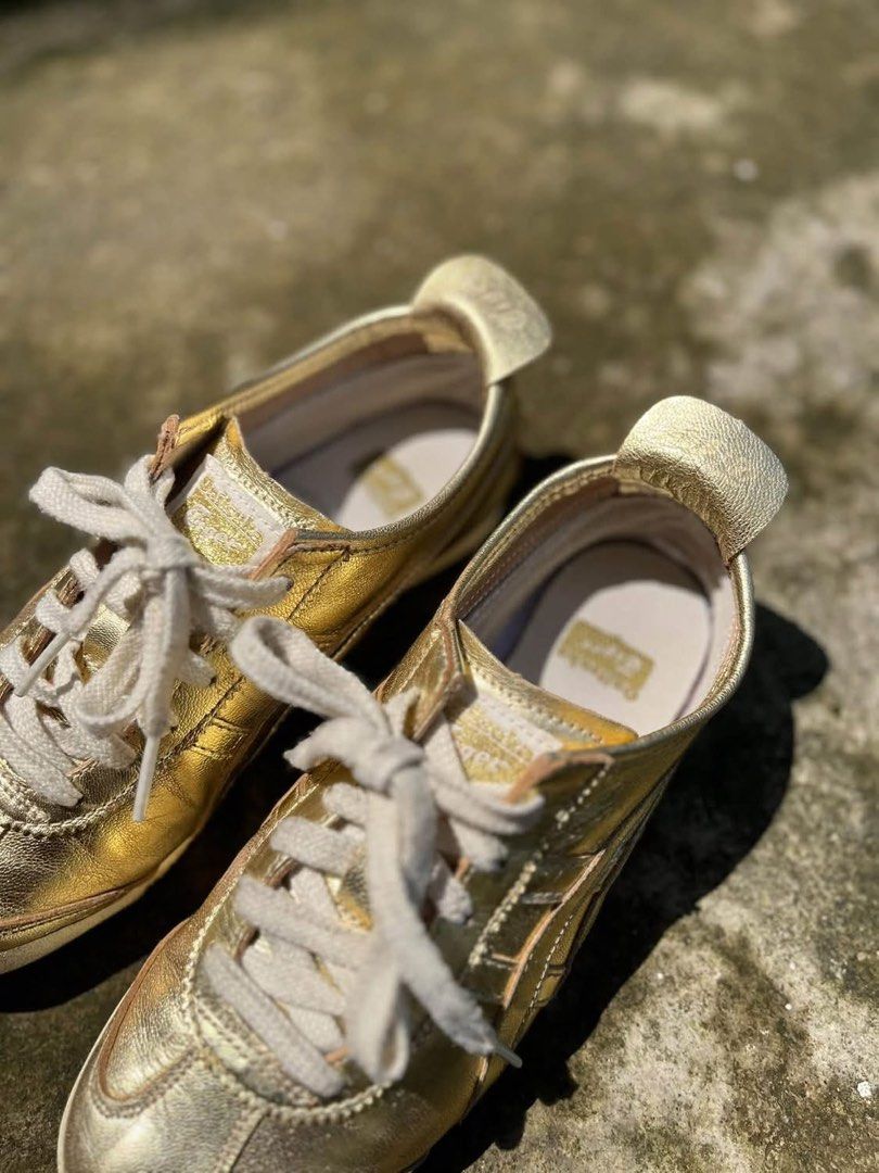 Onitsuka Tiger Metallic Gold Sneakers (Category: Sneakers) located in Molave. Submitted by mattjalamanadoromal323 (Listing ID 1467522818, Image 3). Description: - Brand: Onitsuka Tiger - Color: Metallic gold with light beige laces and heel tab - Design: Classic low-top statement sneakers - Sole: Textured rubber outsole with great grip - Condition: Minor creasing on the metallic finish from normal wear; insoles are clean with branded tags intact.