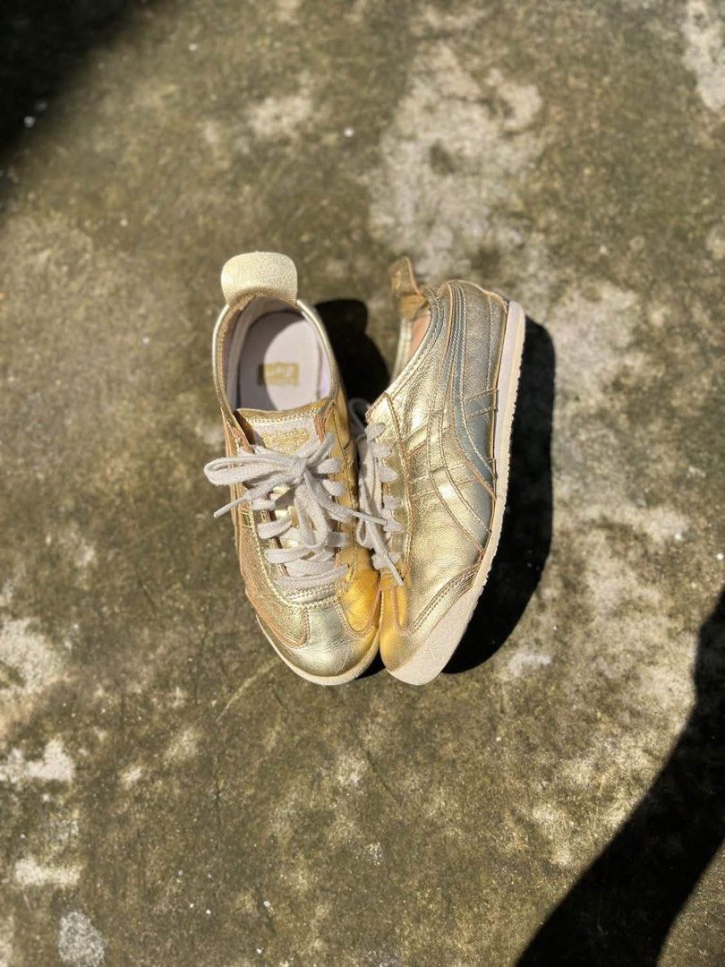 Onitsuka Tiger Metallic Gold Sneakers (Category: Sneakers) located in Molave. Submitted by mattjalamanadoromal323 (Listing ID 1467522818, Image 1). Description: - Brand: Onitsuka Tiger - Color: Metallic gold with light beige laces and heel tab - Design: Classic low-top statement sneakers - Sole: Textured rubber outsole with great grip - Condition: Minor creasing on the metallic finish from normal wear; insoles are clean with branded tags intact.