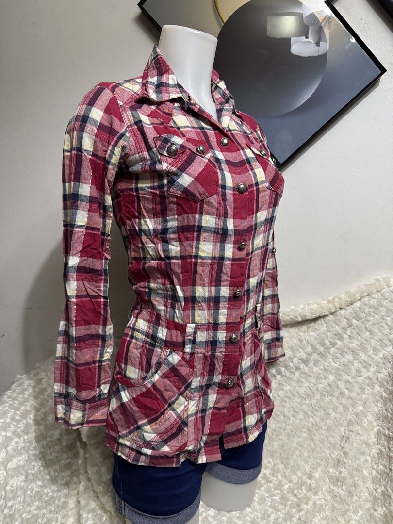 ONLY Red Plaid Button-Up Tunic Shirt Size 160/80A (Category: Blouses) located in Marikina City. Submitted by lorradel (Listing ID 1467504518, Image 2). Description: - fits XS-S - Brand: ONLY - Style: Red plaid tunic shirt with long sleeves - Size: 160/80A - Details: Button-front closure, two chest pockets, and two waist pockets with button flaps - Feature: Eye-catching metallic silver lettering graphic across the back shoulders - Material: Lightw