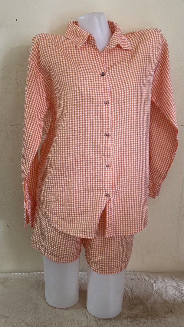 Orange Gingham Button Down Shirt Shorts Lounge Set HT (Category: Sets or Coordinates) located in Santa Cruz. Submitted by zellethrifts (Listing ID 1467388362, Image 1). Description: • Bought in Japan 🇯🇵 • Brand new / unused • Fits XS to small • In excellent condition • Photos taken using mannequin only 🚚 Shipping via J&T only 📦 Shipping fee to be shouldered by buyer 💳 Mode of payment: GCash 📍 Santa Cruz, Laguna.