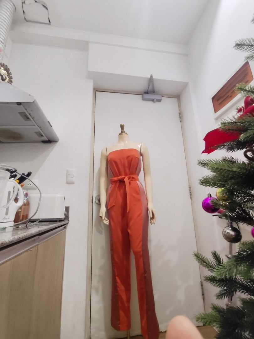 Orange Jumpsuit (Category: Jumpsuits) located in Manila. Submitted by deleonhann57311 (Listing ID 1467422162, Image 2). Description: small to semi medium Italian brand fabric with belt.