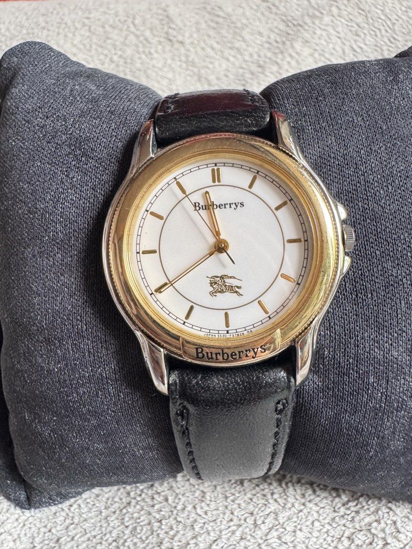 Original Burberrys vintage quartz (Category: Luxury Watches) located in Muntinlupa City. Submitted by felma31 (Listing ID 1467436255, Image 2). Description: White dial, gold-tone fluted/ridged bezel, stainless steel/base metal case, and a black leather strap..