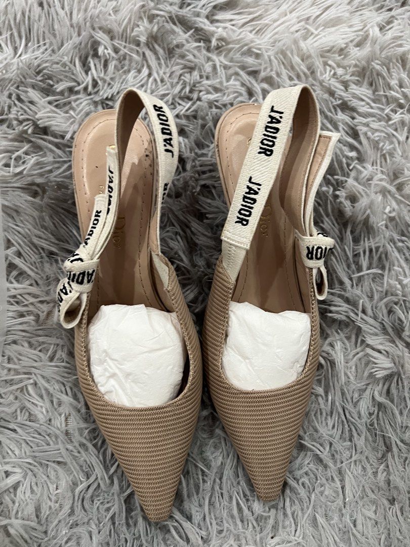 Original Christian Dior Kitty Heel (Category: Sneakers & Footwear) located in Quezon City. Submitted by tangled8 (Listing ID 1467418920, Image 1). Description: Original Christian Dior Kitty Heel size 5.5 fits size 6 color Powder Nude bought in Lotte Mall Korea..