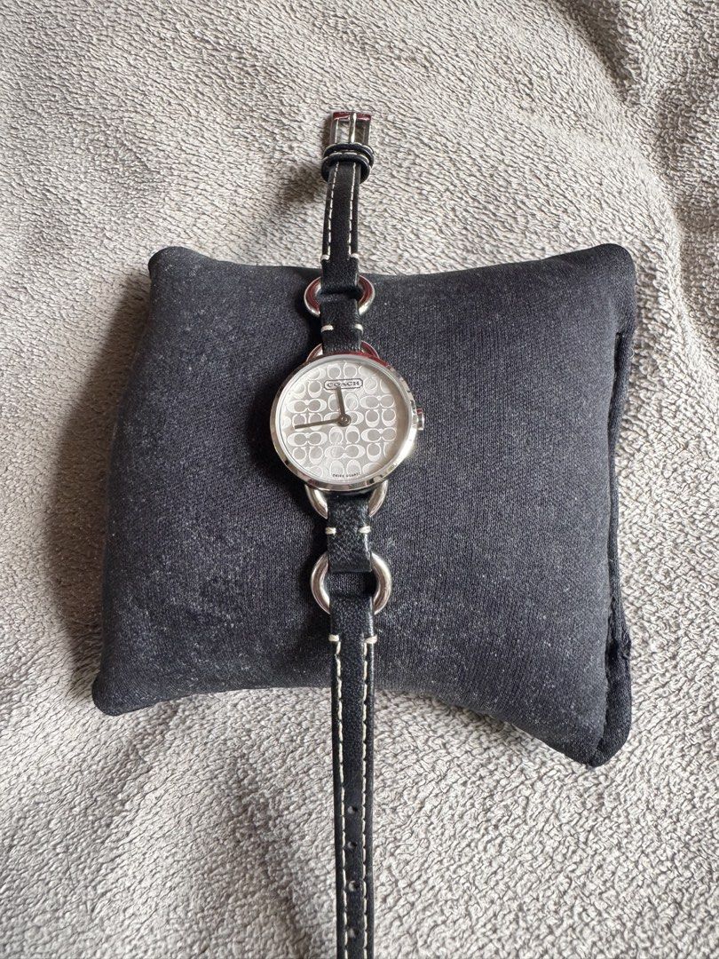Original Coach Dainty vintage watch (Category: Luxury Watches) located in Muntinlupa City. Submitted by felma31 (Listing ID 1467394521, Image 3). Description: This is a vintage Coach Swiss Quartz women’s wristwatch featuring a silver-tone round case (approx. 20mm–22mm), a signature “C” monogram patterned dial, and a black leather and steel chain-link style stra.