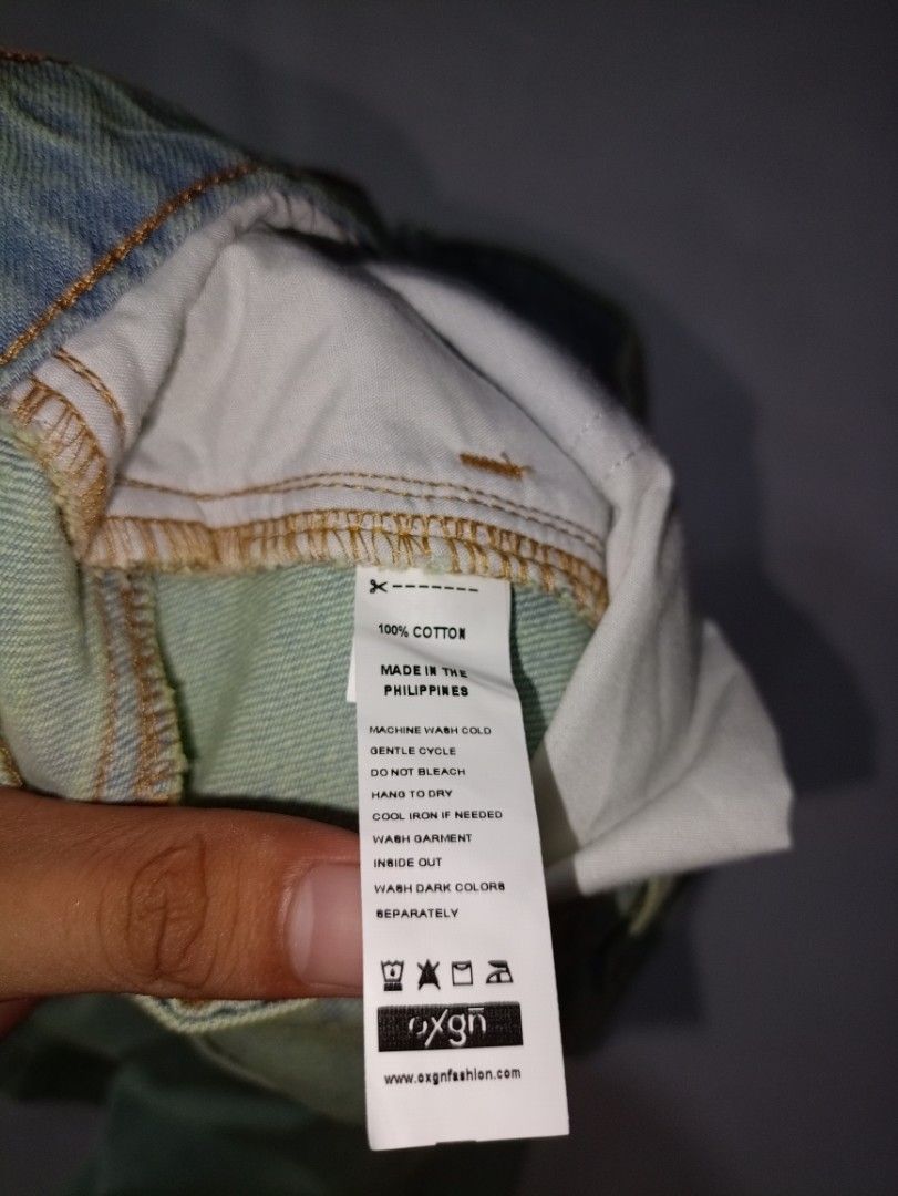 Oxgn Denim Cargo Shorts Medium (Category: Shorts) located in Caloocan City. Submitted by grandturtle-371b8d (Listing ID 1467397645, Image 3). Description: - Brand: OXGN - Size: Medium - Material: 100% Cotton (Made in the Philippines) - Color/Finish: Light wash blue with faded details at the front - Features: Classic utility pockets on both sides, button closure with zip fly.