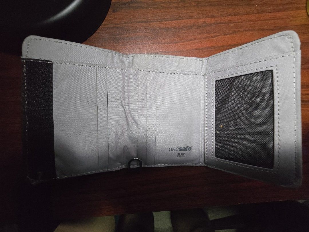 Pacsafe RFIDsafe Trifold Wallet (Category: Wallets & Card Holders) located in Taytay. Submitted by kaboomerangle (Listing ID 1467420263, Image 2). Description: - Authentic Pacsafe trifold wallet - Item still in great condition - Used for less than a year Message me for your offers.