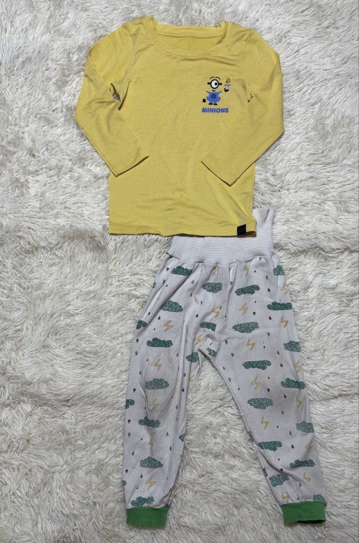 Pajama Set kids (Category: Babies & Kids Fashion) located in Dagupan City. Submitted by iamrannflores (Listing ID 1467420297, Image 1). Description: - Brand: Uniqlo - Item: Kids Pajama Set - Color/Design: Yellow and white with Minion graphic top and cloud/lightning bottoms - Size: 100 (Fits height 95-105cm, chest 49-55cm) - Material: Soft rayon, polyester, and spandex blend - Features: Long sleeves, green ankle cuffs, and wide elastic waistband f
