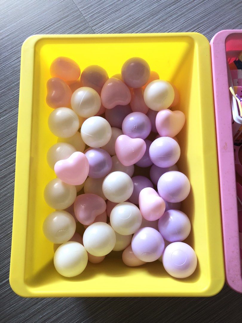 Pastel pit balls (Category: Infant Playtime) located in Cavite. Submitted by ai__chang (Listing ID 1467404654, Image 2). Description: - Pastel mix of plastic balls and heart-shaped pieces in pink, purple, white, and cream - Ideal for sensory play, ball pits, and toddler activities - Clean, sanitized, and ready for use - PM to deal or for shipping inquiries!.