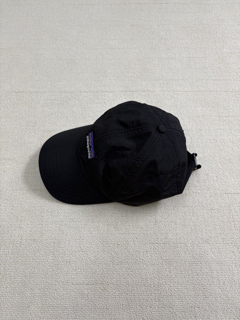 Patagonia Black Cap Nylon Hat (Category: Caps & Hats) located in Manila. Submitted by porma.market (Listing ID 1467404069, Image 3). Description: - 100% lightweight and quick-drying nylon material - Classic woven logo patch on the structured front panel - Breathable mesh lining for all-day comfort - Adjustable strap closure for a customizable fit - Ideal for hiking, running errands, or casual everyday wear.