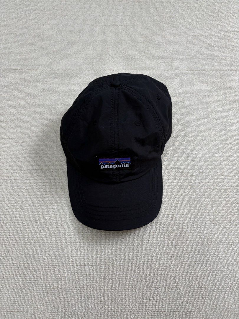 Patagonia Black Cap Nylon Hat (Category: Caps & Hats) located in Manila. Submitted by porma.market (Listing ID 1467404069, Image 2). Description: - 100% lightweight and quick-drying nylon material - Classic woven logo patch on the structured front panel - Breathable mesh lining for all-day comfort - Adjustable strap closure for a customizable fit - Ideal for hiking, running errands, or casual everyday wear.