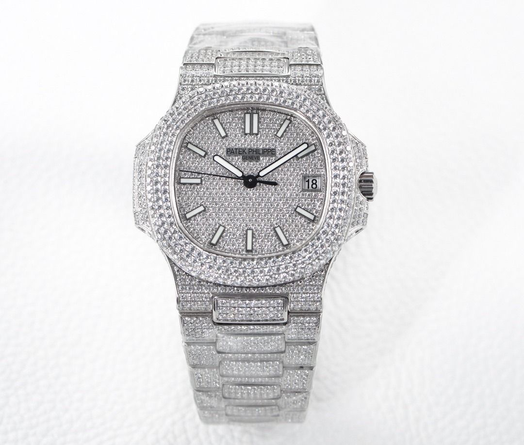 Patek Philippe Diamond Paved Nautilus Watch (Category: Luxury Watches) located in Valenzuela. Submitted by epicforest.cad1e9 (Listing ID 1467476651, Image 1). Description: - Full iced-out Patek Philippe Nautilus timepiece - Entire case, bezel, dial, and bracelet covered in micro-set diamonds - Features luminous hands, hour markers, and a date window at 3 o'clock - Built on a durable silver-toned stainless steel base structure.