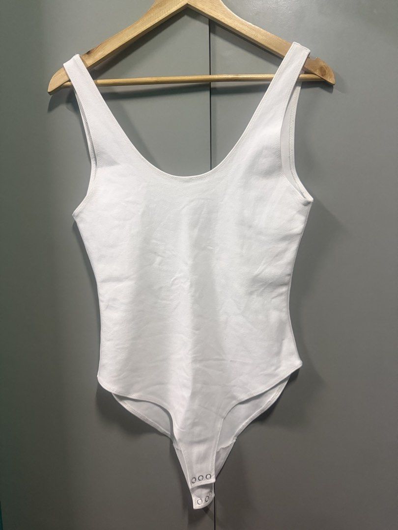 Patton White Bodysuit (Category: Sleeveless) located in Caloocan City. Submitted by calmphoenix.d298a7 (Listing ID 1467560122, Image 1). Description: - Brand/Model: Patton white tank bodysuit - Size: Large - Design: Classic scoop neck with a clean look - Closure: Bottom snap buttons for easy wear - Versatility: Easy to pair with jeans or shorts - Condition: Brand new / Excellent - RFS: Downsizing to a Small 🥹💗.