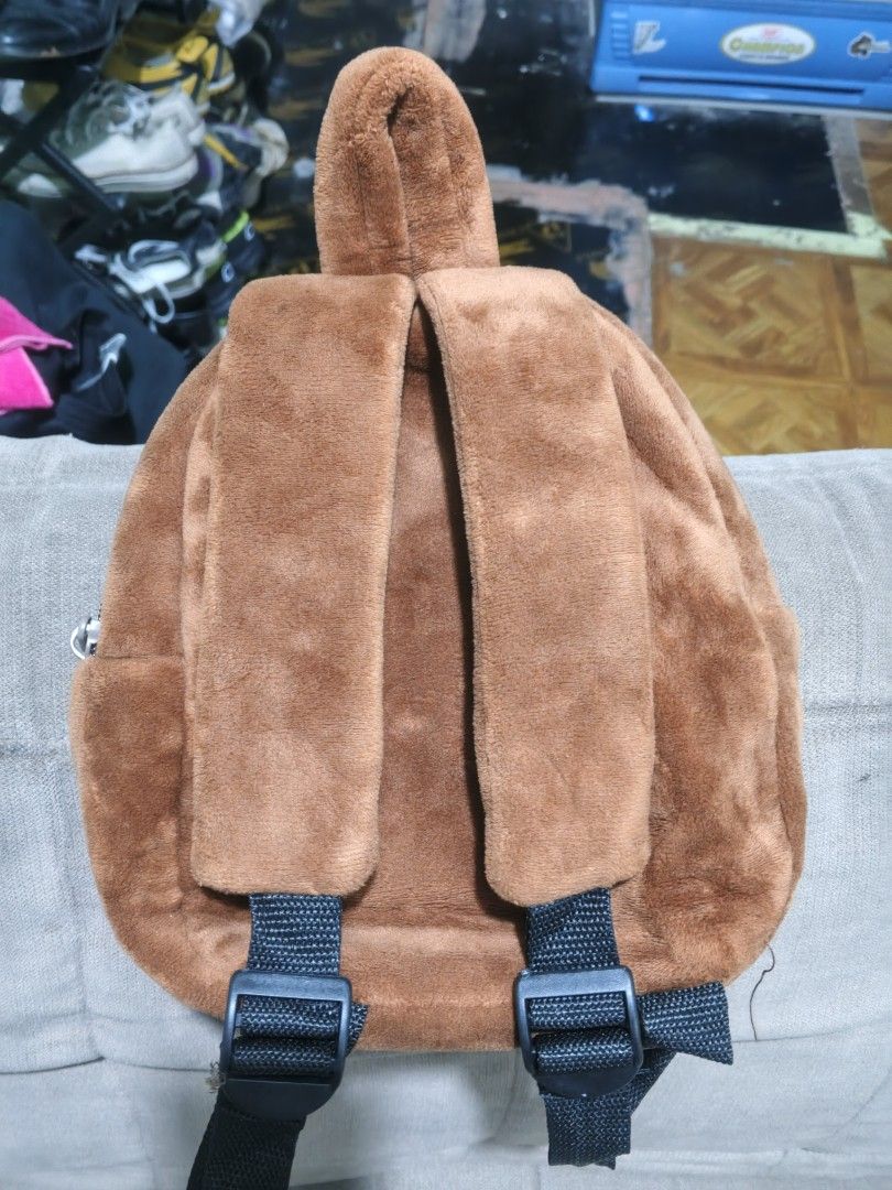 Paul Frank Brown Plush Monkey Backpack (Category: Backpacks) located in Manila. Submitted by thriftthings824 (Listing ID 1467493423, Image 3). Description: - Authentic Paul Frank mini plush backpack in brown - Features iconic Julius the Monkey embroidered face with a front zip pocket - Made of soft, cozy fuzzy fabric - Adjustable black shoulder straps and convenient top handle - Clean interior lining with official 2019 tag - Compact size, perfect