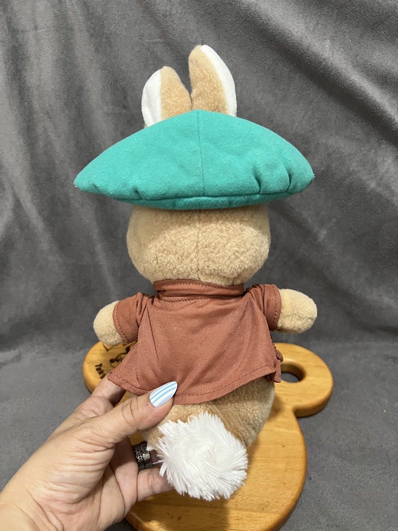 Peter Rabbit plush toy with green hat and jacket (Category: Plushies & Soft Toys) located in Las Pinas. Submitted by maple0305 (Listing ID 1467401045, Image 3). Description: - Official Peter Rabbit character plush - Wears signature teal green hat and brown jacket with a cute fluffy white tail - Made from ultra-soft fabric with high-quality embroidered facial features - Self-standing design - Clean, well-kept, and collector-ready.