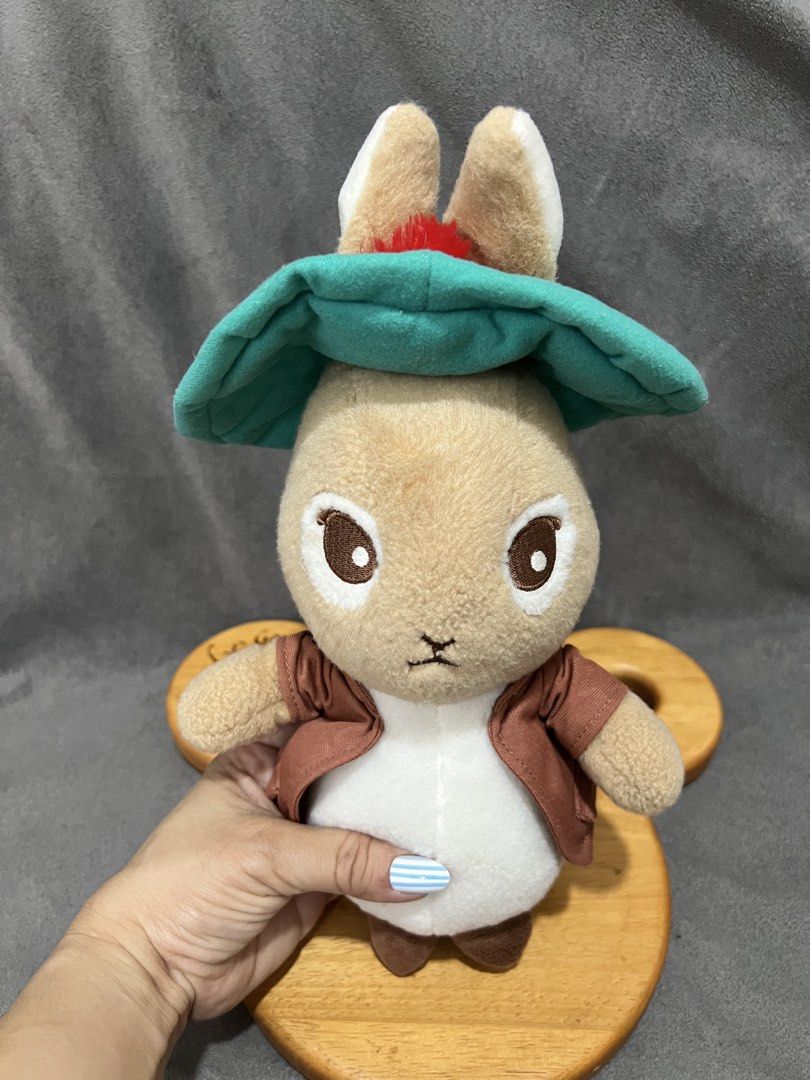 Peter Rabbit plush toy with green hat and jacket (Category: Plushies & Soft Toys) located in Las Pinas. Submitted by maple0305 (Listing ID 1467401045, Image 2). Description: - Official Peter Rabbit character plush - Wears signature teal green hat and brown jacket with a cute fluffy white tail - Made from ultra-soft fabric with high-quality embroidered facial features - Self-standing design - Clean, well-kept, and collector-ready.