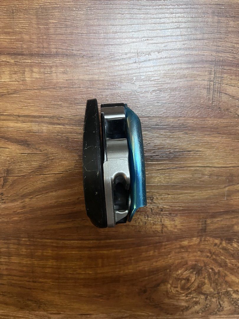 Petzl Grigri Belay Device (Category: Hiking & Camping) located in Davao. Submitted by komorebi.konbini (Listing ID 1467494084, Image 3). Description: Petzl Grigri in blue. Standard assisted braking device for rock climbing and sport climbing. Normal scuffs and scratches on the anodized aluminum body from regular crag use. Lever and cam mechanism move smoothly. Still plenty of life left for your next climbing sesh..