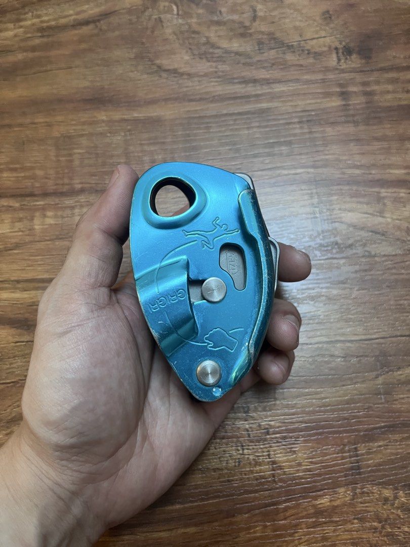 Petzl Grigri Belay Device (Category: Hiking & Camping) located in Davao. Submitted by komorebi.konbini (Listing ID 1467494084, Image 2). Description: Petzl Grigri in blue. Standard assisted braking device for rock climbing and sport climbing. Normal scuffs and scratches on the anodized aluminum body from regular crag use. Lever and cam mechanism move smoothly. Still plenty of life left for your next climbing sesh..