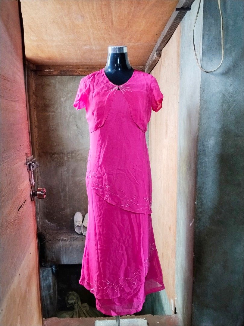 Pink Beaded Layered Maxi Dress (Category: Evening dresses & gowns) located in Caloocan City. Submitted by magtaanber_moon (Listing ID 1467405050, Image 1). Description: - Color: Bright pink - Style: Maxi dress with layered skirt and simple pull-on design - Details: Delicate beadwork patterns along the hem and tiered layers - Sleeves: Short sleeves - Included: Matching short-sleeve shrug jacket with beaded neckline - Material: Lightweight and comf