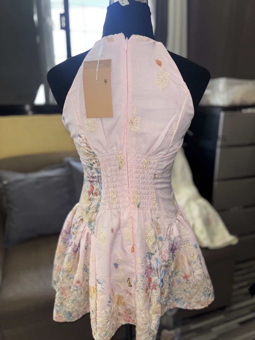 Pink Halter Floral Dress Size Medium (Category: Dresses) located in Caloocan City. Submitted by niki.niki. (Listing ID 1467504047, Image 3). Description: - Condition: Brand new with tag still attached - Color: Pink (Yellow version also available) - Size: Medium (fits bust 36 inches) - Design: Halter neck, delicate floral print, and butterfly motifs with a structured flare skirt - Fit & Comfort: Fully lined with built-in inner shorts, smocked back