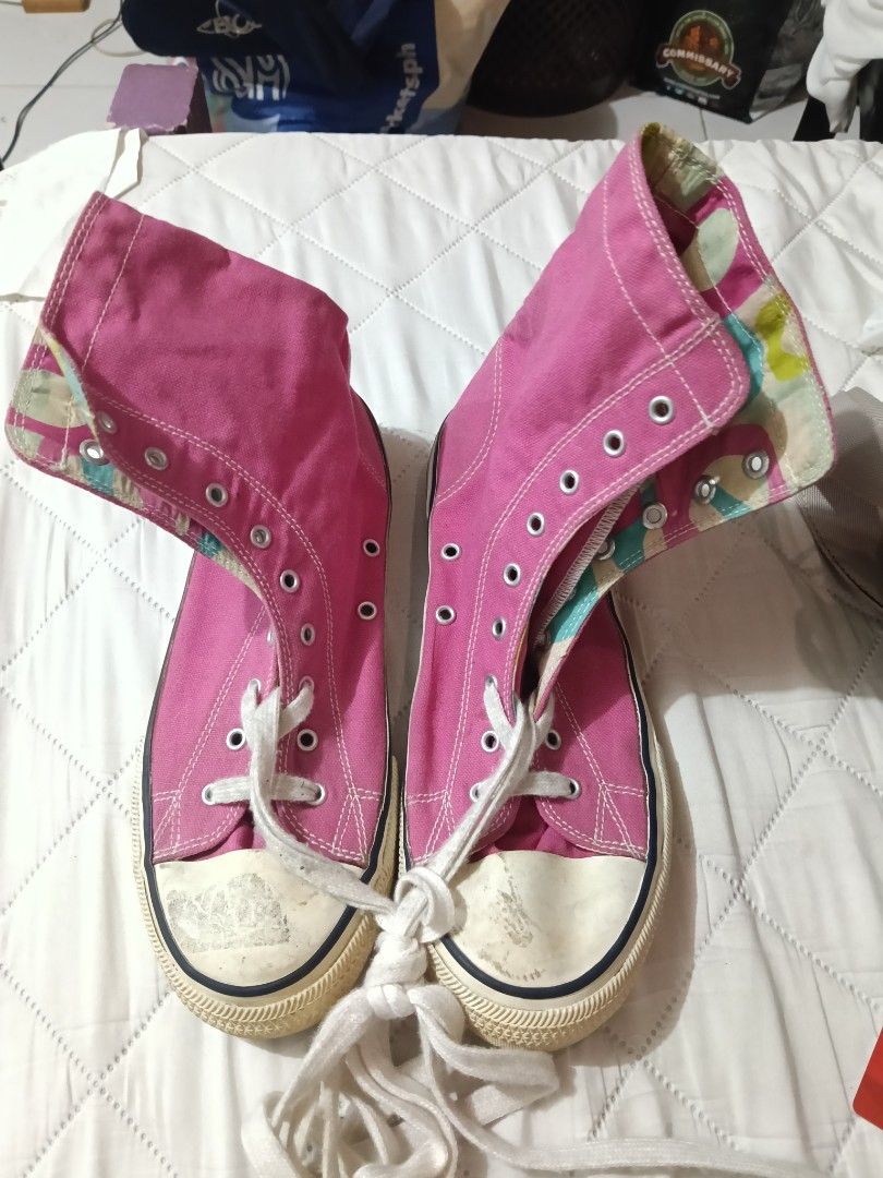 Pink High Top Canvas Sneakers (Category: Sneakers) located in Manila. Submitted by theresasebastian03 (Listing ID 1467496346, Image 1). Description: - Color: Pink with white laces and outsoles - Design: High-top canvas with playful camouflage print lining on fold-down collars - Condition: Pre-loved with characteristic scuff marks on cream rubber toe caps - Style: Casual everyday shoes - Inclusion: Comes with original laces.