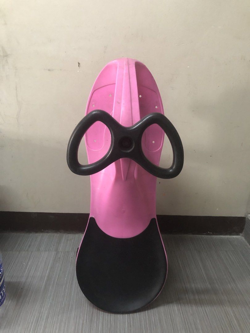 Pink twist car for kids (Category: Kids Toys) located in Cavite. Submitted by ai__chang (Listing ID 1467462456, Image 1). Description: - Heavy duty. Kaya kahit matanda ang sumakay. - Color: Pink and black - Smooth-rolling wheels for indoor and outdoor fun - Easy-to-use steering wheel setup for toddlers - Shows normal signs of use on plastic and wheels - Structurally solid and ready for the next child to enjoy.