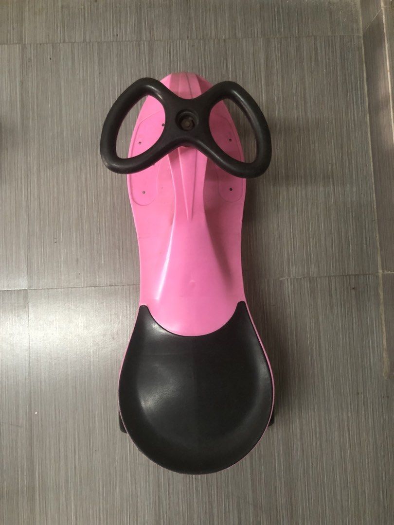 Pink twist car for kids (Category: Kids Toys) located in Cavite. Submitted by ai__chang (Listing ID 1467462456, Image 2). Description: - Heavy duty. Kaya kahit matanda ang sumakay. - Color: Pink and black - Smooth-rolling wheels for indoor and outdoor fun - Easy-to-use steering wheel setup for toddlers - Shows normal signs of use on plastic and wheels - Structurally solid and ready for the next child to enjoy.