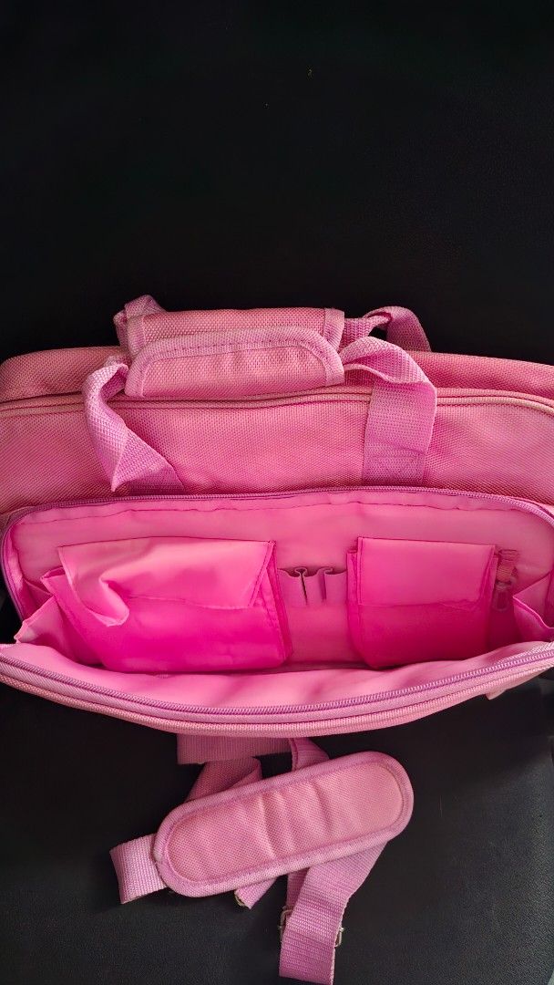 Pink Vaio Laptop Bag with Shoulder Strap (Category: Laptop Bags & Sleeves) located in Marikina City. Submitted by makimki (Listing ID 1467399657, Image 3). Description: - Bright pink Vaio laptop bag, ideal for daily use and on-the-go tech carriers - Made from durable fabric with a secure Velcro laptop sleeve inside the main compartment - Includes a matching shoulder strap with a padded cushion for all-day comfort - Features multiple inner compart