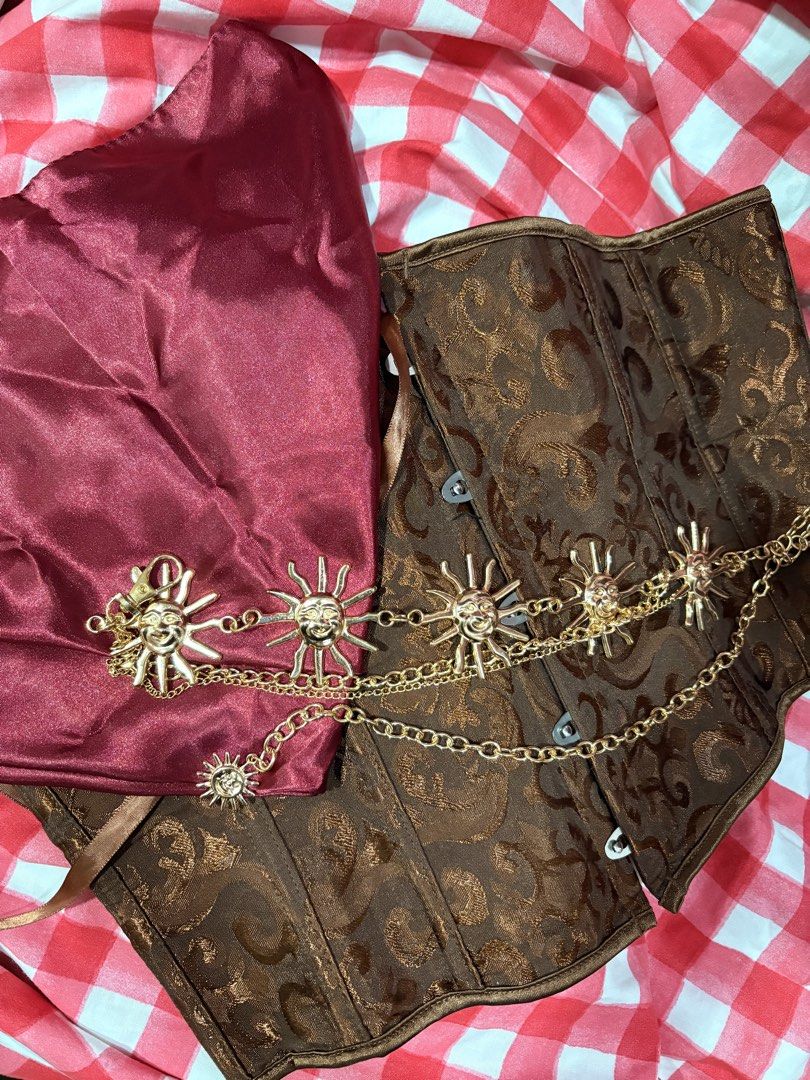 Pirate Corset Chain Bandana Set (Category: Belts) located in Quezon City. Submitted by darshopxd (Listing ID 1467567099, Image 2). Description: - Brown damask corset with structured boning and front hooks - Includes a gold-tone chain belt with smiling sun pendants - Comes with a deep red satin fabric piece - Great vintage style for Renaissance faires and themed parties - Complete ready-to-wear outfit combination.