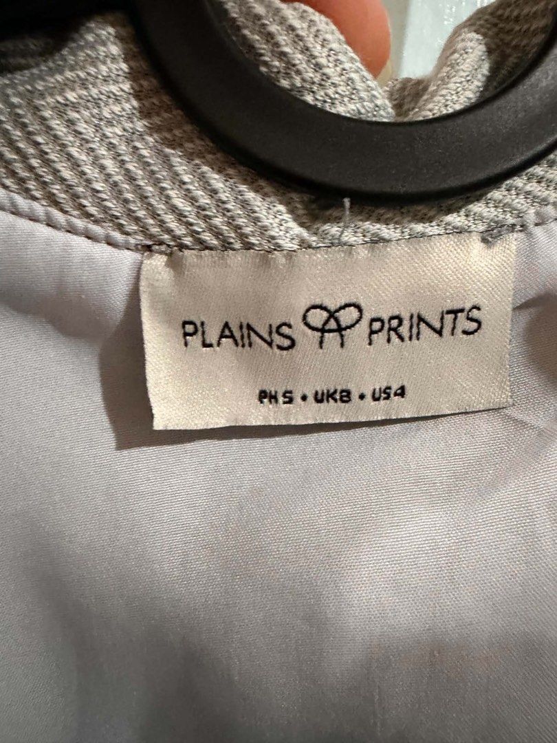 Plains & Prints Grey Herringbone Vest and Skort Set (Category: Sets or Coordinates) located in Quezon City. Submitted by bela_goodfinds (Listing ID 1467447463, Image 2). Description: - Brand: Plains & Prints - Item: Matching double-breasted vest and skort set - Pattern: Grey and white herringbone - Size: PH S / UK 8 / US 4 - Vest Details: Lapels and front pockets - Skort Details: Wrap-around front flap, subtle slit, and back zip closure - Style: 
