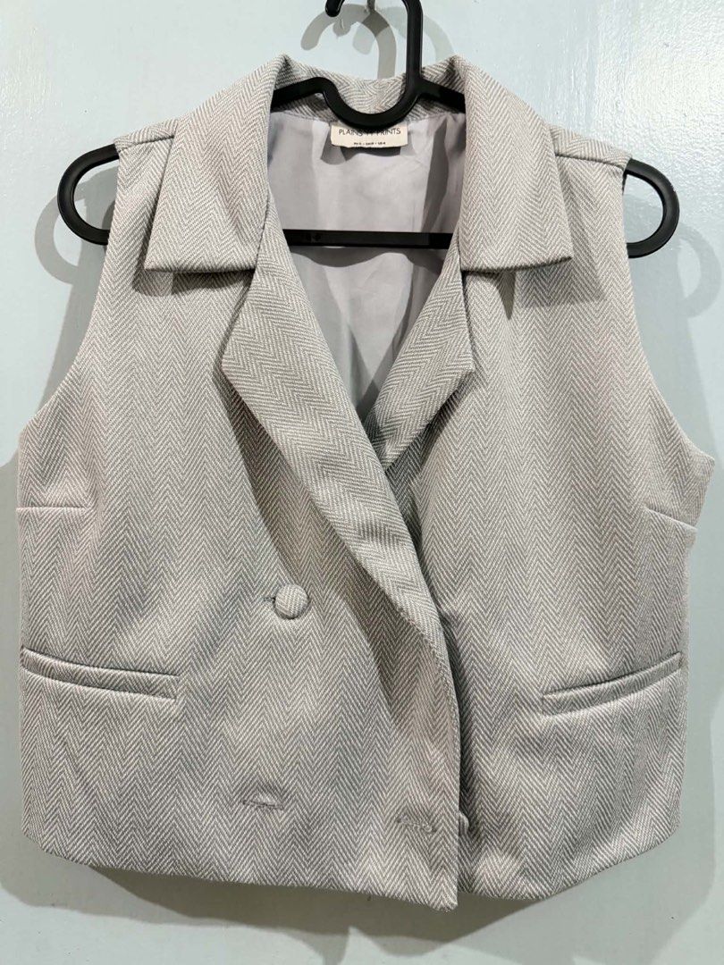 Plains & Prints Grey Herringbone Vest and Skort Set (Category: Sets or Coordinates) located in Quezon City. Submitted by bela_goodfinds (Listing ID 1467447463, Image 1). Description: - Brand: Plains & Prints - Item: Matching double-breasted vest and skort set - Pattern: Grey and white herringbone - Size: PH S / UK 8 / US 4 - Vest Details: Lapels and front pockets - Skort Details: Wrap-around front flap, subtle slit, and back zip closure - Style: 
