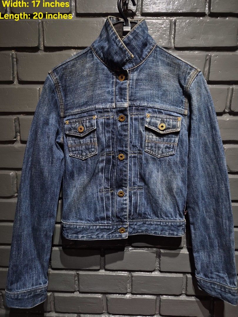 Polo Jeans Co. RL 1967 Denim Jacket (Category: Coats, Jackets and Outerwear) located in Davao. Submitted by rodrigoani57168 (Listing ID 1467370256, Image 1). Description: - Brand: Polo Jeans Co. RL 1967 - Wash: Heavy vintage dark wash with contrast yellow stitching - Details: Structured stand-up collar, button-front closure, dual chest flap pockets - Special Feature: Iconic American flag tag near the bottom hem - Hardware: Polo Jeans Co. branded 