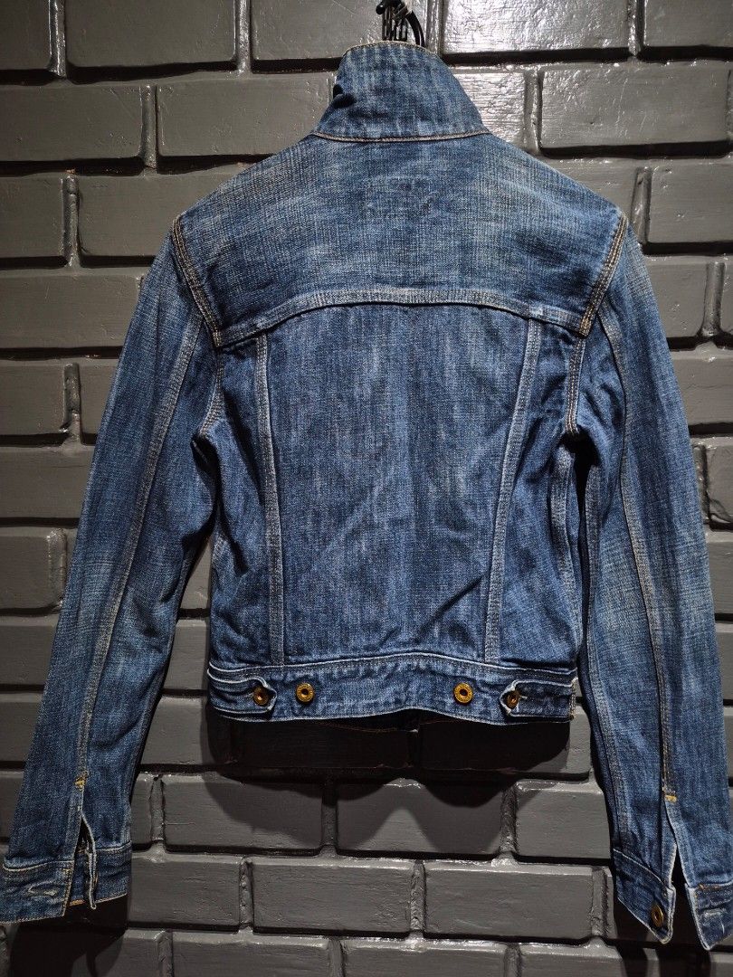 Polo Jeans Co. RL 1967 Denim Jacket (Category: Coats, Jackets and Outerwear) located in Davao. Submitted by rodrigoani57168 (Listing ID 1467370256, Image 2). Description: - Brand: Polo Jeans Co. RL 1967 - Wash: Heavy vintage dark wash with contrast yellow stitching - Details: Structured stand-up collar, button-front closure, dual chest flap pockets - Special Feature: Iconic American flag tag near the bottom hem - Hardware: Polo Jeans Co. branded 