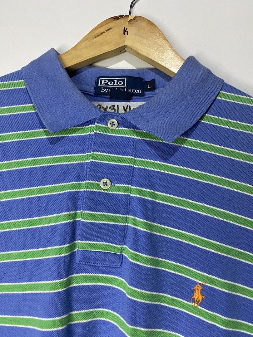 POLOSHIRT (Category: Tshirts & Polo Shirts ) located in Jaen. Submitted by oshimamark58418 (Listing ID 1467520440, Image 3). Description: - Brand: Polo by Ralph Lauren - Design: Blue and green horizontal stripes with iconic embroidered pony logo - Size: XXL (Actual measurement: 22 inches width x 31 inches length) - Collar style: Classic polo collar with two-button placket - Condition: Good pre-owned condition, clean and well-kept.