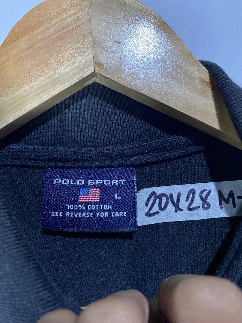 POLOSHIRT (Category: Tshirts & Polo Shirts ) located in Jaen. Submitted by oshimamark58418 (Listing ID 1467522296, Image 3). Description: - Brand: Polo Sport (Ralph Lauren) - Color: Classic Black with red embroidered chest logo - Size: Medium (Tag says L, actual measurement: 20 inches width x 28 inches length) - Material: 100% Premium Cotton for maximum comfort - Condition: Pre-loved, well-maintained - Style: Versatile for casual outings or smart