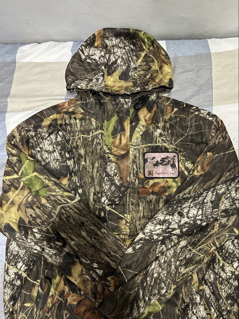 Port Authority | Camouflage Hooded Jacket (Category: Coats, Jackets and Outerwear) located in Balanga. Submitted by thrifted.btn (Listing ID 1467402968, Image 1). Description: [L] Port Authority Camo Hooded Jacket Brand: Port Authority Size: Large (L) Design: Heavyweight RealTree style camouflage with custom “Sag River Camp” chest patch.