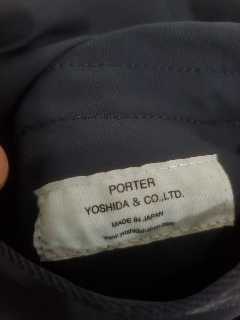 Porter Yoshida & Co. Shoulder Bag (Category: Sling Bags) located in Manila. Submitted by royalrabbit.7b2a11 (Listing ID 1467396732, Image 3). Description: - Brand: Porter Yoshida & Co. (Made in Japan) - Color: Dark Navy - Material: Lightweight, durable nylon - Closure: Flap with snap button - Strap: Adjustable for custom fit - Authenticity: Genuine piece from the Japan Luggage Association - Condition: Clean inside and out, excellent pre-loved con