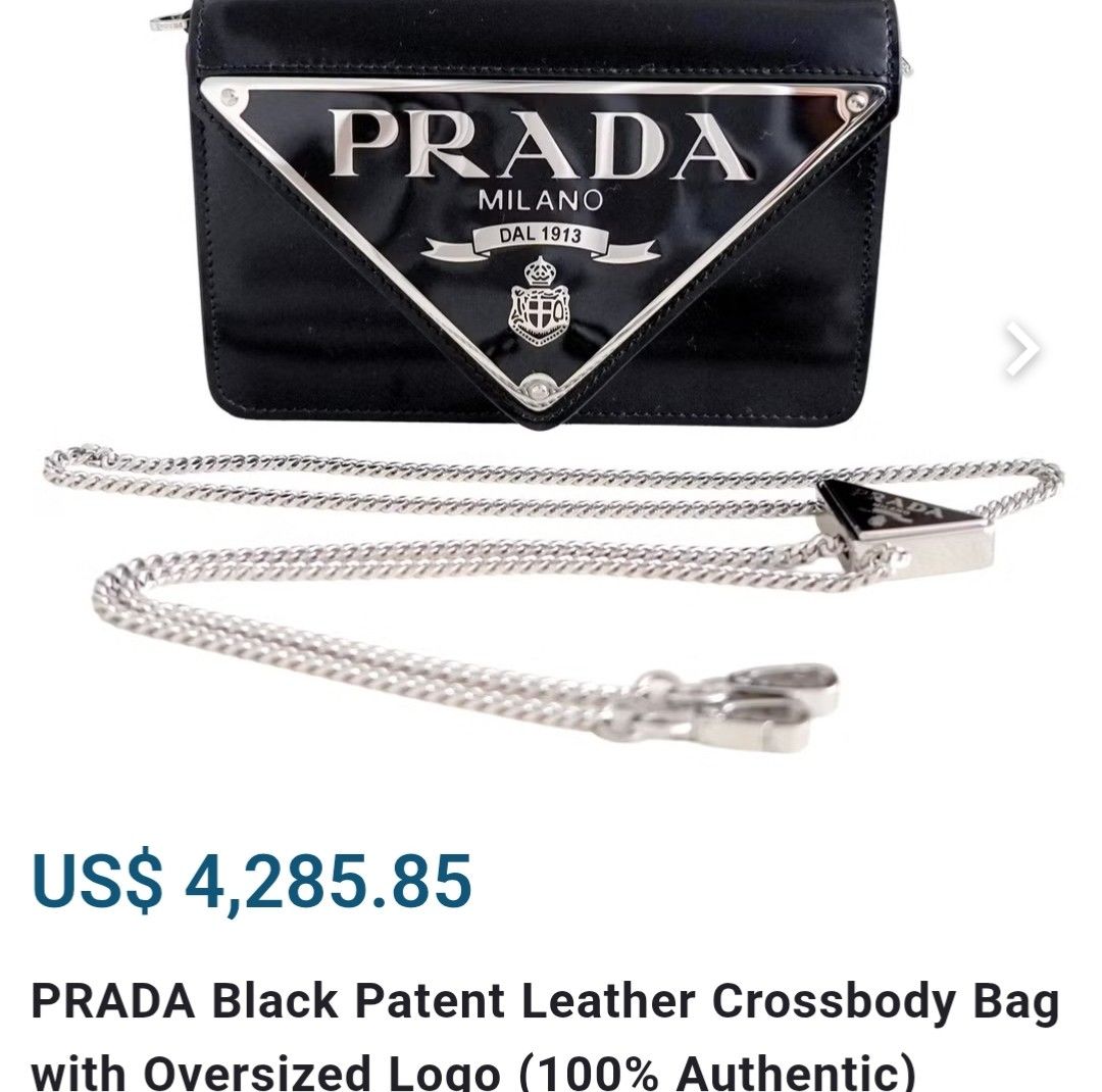 Prada (Category: Shoulder Bags) located in Imus. Submitted by nikv.omcly (Listing ID 1467398608, Image 3). Description: The item shown is a Prada Black Spazzolato Leather Maxi Triangle Logo Small Crossbody Flap Bag (also known as the Prada Spazzolato Triangle Logo Plate Flap Chain Crossbody Bag). Material: Black spazzolato (brushed/patent-style) leather Design: Features a bold, oversized enameled metal triangular Prada Milano logo plate on the fr