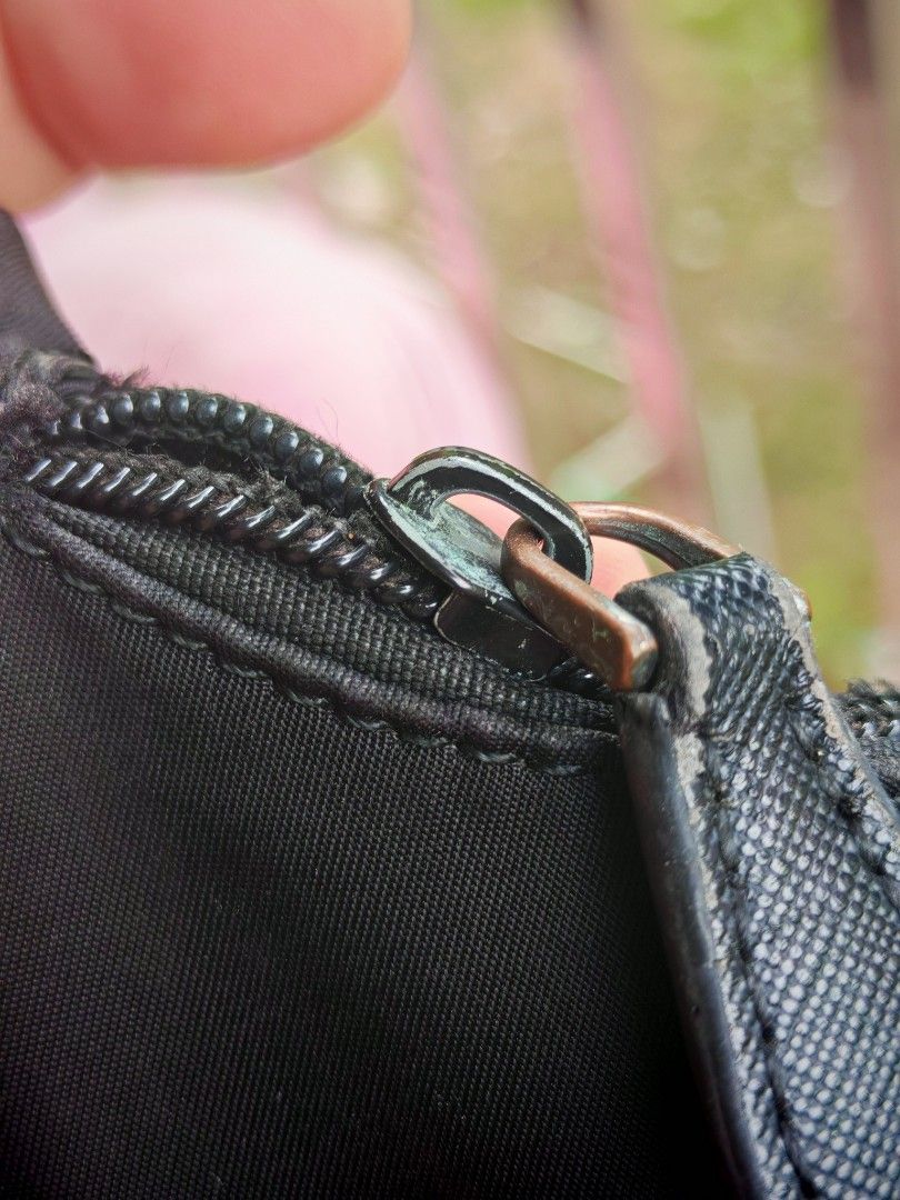 Prada Black Nylon Mini Shoulder Bag (Category: Luxury Bags & Wallets) located in Manila. Submitted by cleverwhale_45b7bc (Listing ID 1467377135, Image 3). Description: - Prada mini shoulder bag in classic black nylon - Features the iconic triangular logo plaque on the front - Secure top zip closure with sleek silver-tone hardware - Interior lined with signature Prada logo fabric and Milano metal plaque - Compact and lightweight design, perfect fo