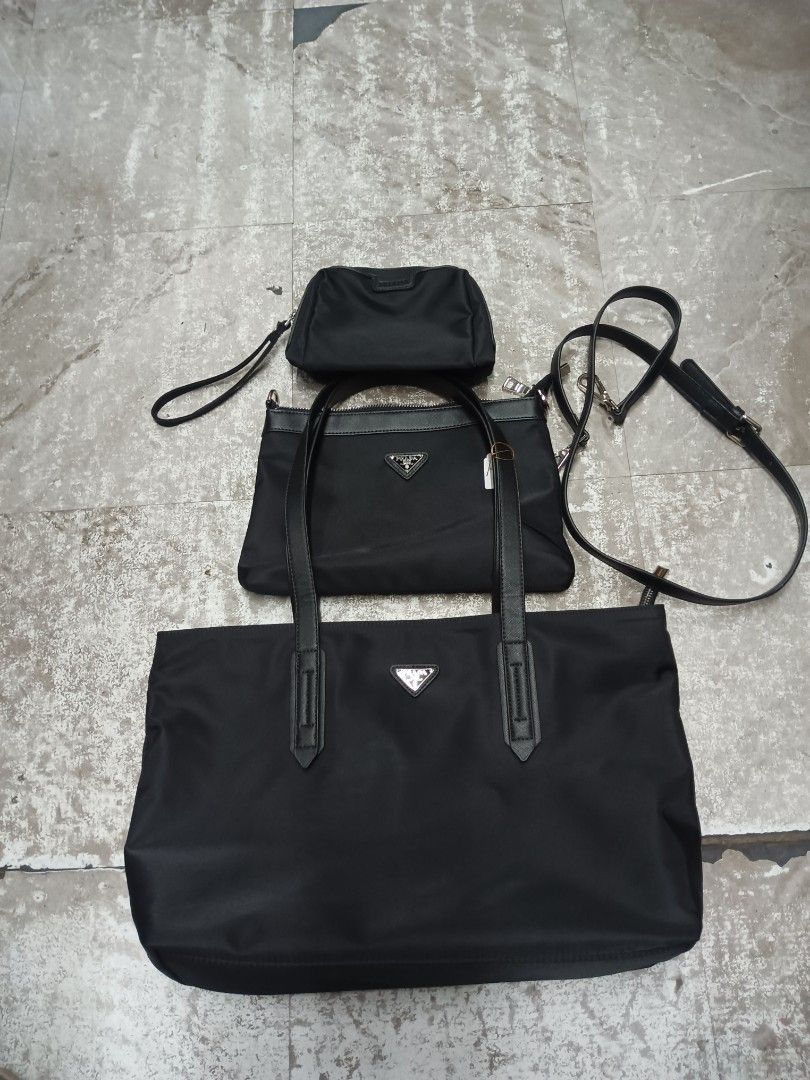 Prada Black Nylon Multi-Piece Tote Bag Set (Category: Luxury Bags & Wallets) located in Baguio. Submitted by brandeditems16 (Listing ID 1467583661, Image 1). Description: - Authentic Black Prada nylon 3-piece bundle - Set includes: Large tote bag, medium shoulder bag (with handles and strap), and small pouch with wrist strap - Features iconic metal triangle logo plaque on each piece - Crafted from durable, lightweight signature nylon fabric with 
