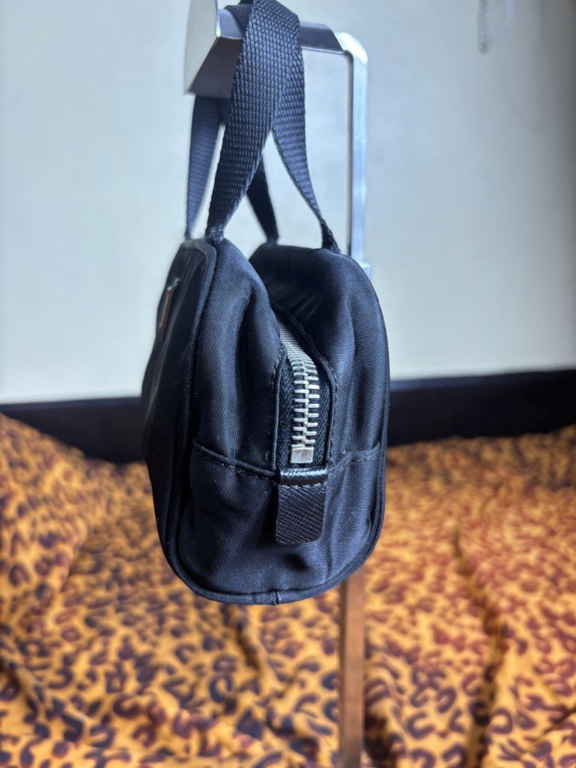 Prada mini bag (Category: Luxury Bags & Wallets) located in Manila. Submitted by earlylifecrisis3 (Listing ID 1467465899, Image 3). Description: Condition 8.5/10 Measure it by inch Width: 7 Length: 4.5 Depth: 3 Handle: 3.5 •Refund / Returns not allowed allowed •Please do check the dimensions size on labels sometimes are not accurate on the sizing •Ask me before purchasing.