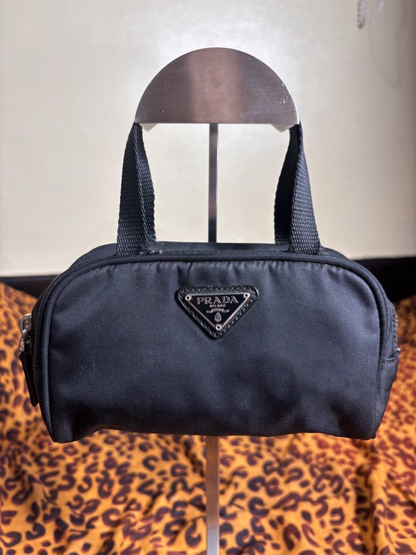 Prada mini bag (Category: Luxury Bags & Wallets) located in Manila. Submitted by earlylifecrisis3 (Listing ID 1467465899, Image 1). Description: Condition 8.5/10 Measure it by inch Width: 7 Length: 4.5 Depth: 3 Handle: 3.5 •Refund / Returns not allowed allowed •Please do check the dimensions size on labels sometimes are not accurate on the sizing •Ask me before purchasing.