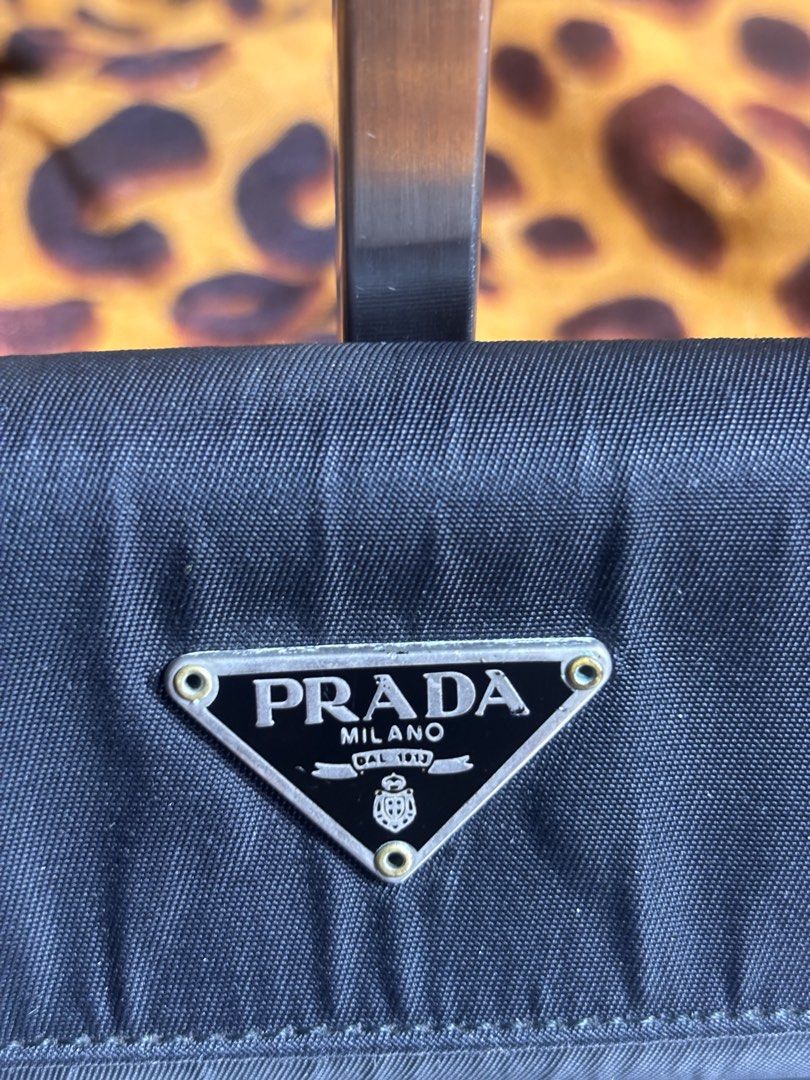 Prada Nylon 6 key holder (Category: Wallets & Card Holders) located in Manila. Submitted by earlylifecrisis3 (Listing ID 1467461434, Image 2). Description: Missing One key holder Condition 8.5/10 Measure it by inch Width: 4 Length: 2.5 Depth: 1 Handle: 0 •Refund / Returns not allowed allowed •Please do check the dimensions size on labels sometimes are not accurate on the sizing •Ask me before purchasing.