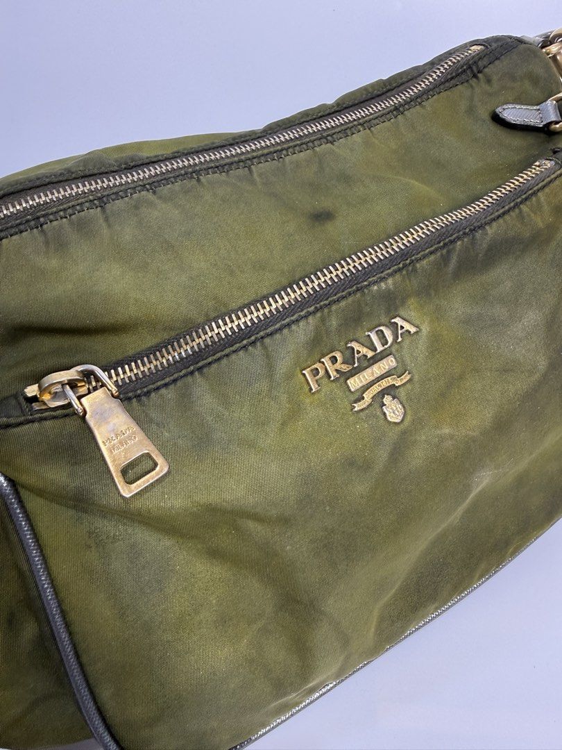 Prada Nylon Crossbody Bag Olive Green (Category: Luxury Bags & Wallets) located in Dasmarinas. Submitted by arjalaph (Listing ID 1467475060, Image 2). Description: - Authentic Prada nylon shoulder bag - Condition: Shows visible fading/discoloration and patina throughout the nylon. Need recolor and bagspa.