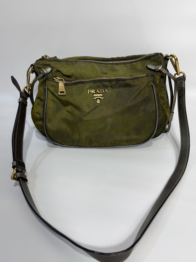 Prada Nylon Crossbody Bag Olive Green (Category: Luxury Bags & Wallets) located in Dasmarinas. Submitted by arjalaph (Listing ID 1467475060, Image 1). Description: - Authentic Prada nylon shoulder bag - Condition: Shows visible fading/discoloration and patina throughout the nylon. Need recolor and bagspa.