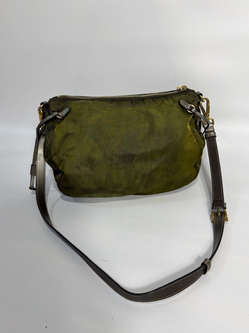 Prada Nylon Crossbody Bag Olive Green (Category: Luxury Bags & Wallets) located in Dasmarinas. Submitted by arjalaph (Listing ID 1467475060, Image 3). Description: - Authentic Prada nylon shoulder bag - Condition: Shows visible fading/discoloration and patina throughout the nylon. Need recolor and bagspa.