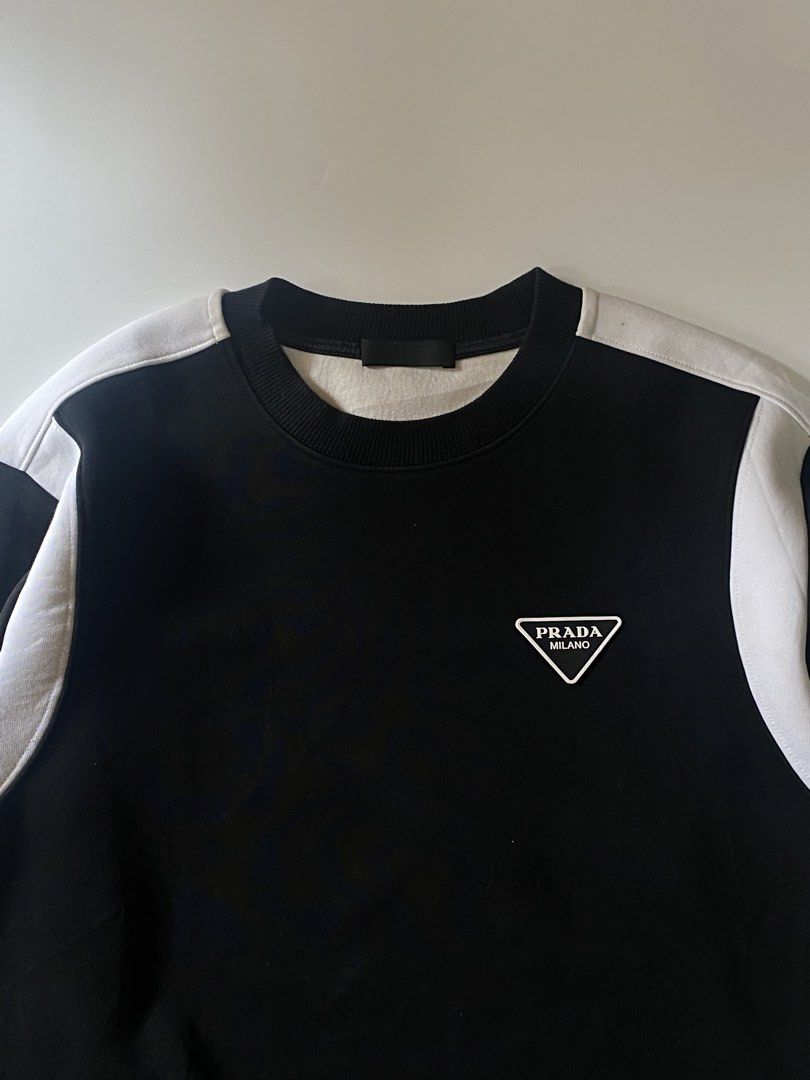 Prada triangle logo sweatshirt (Category: Coats, Jackets and Outerwear) located in Manila. Submitted by finofindthisart (Listing ID 1467401014, Image 3). Description: Length 25 Width 21 Measured it by inches Issue: N/A This is a pre-loved/thrifted items and may show minor signs of issue due to its vintage nature. Kindly manage expectations. No refunds or exchanges will be accepted. 📍Pasay City DM for inquiries..