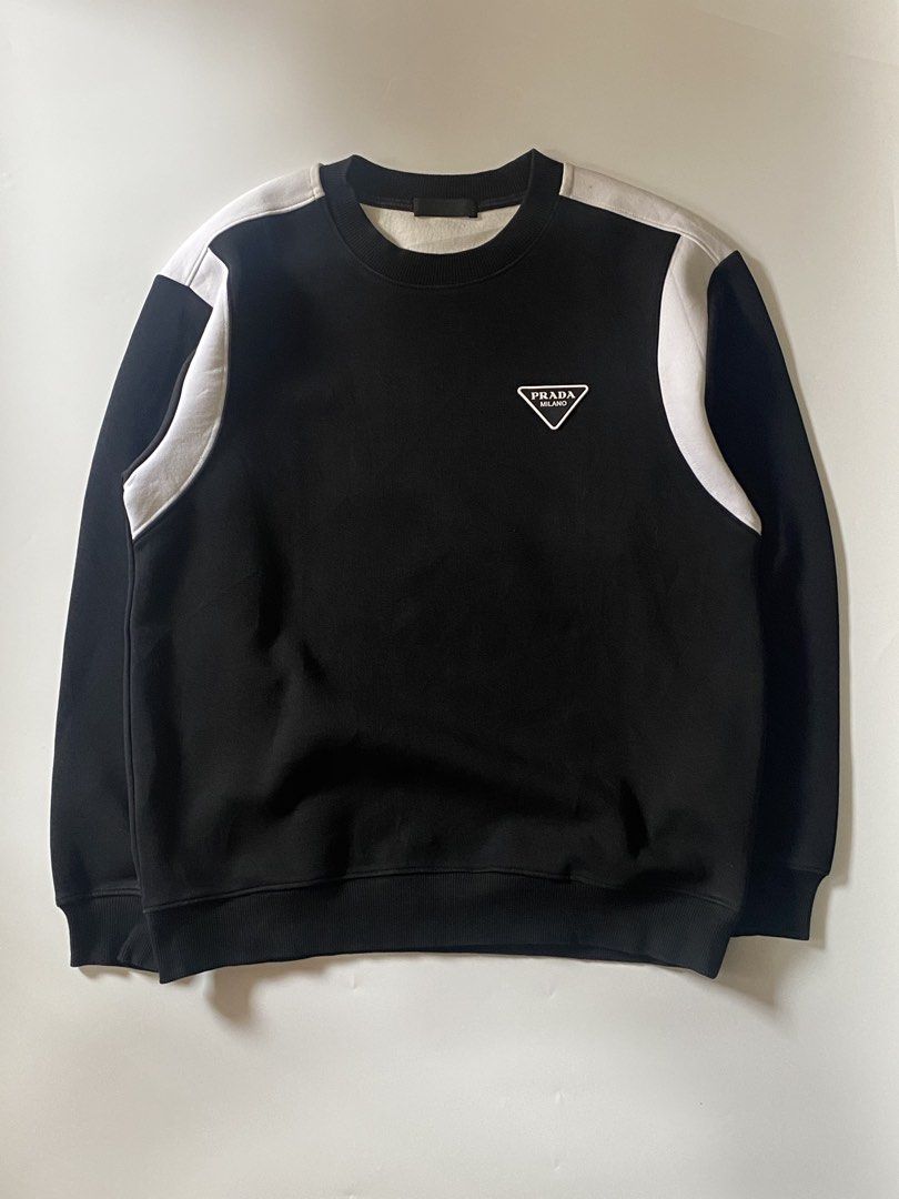 Prada triangle logo sweatshirt (Category: Coats, Jackets and Outerwear) located in Manila. Submitted by finofindthisart (Listing ID 1467401014, Image 2). Description: Length 25 Width 21 Measured it by inches Issue: N/A This is a pre-loved/thrifted items and may show minor signs of issue due to its vintage nature. Kindly manage expectations. No refunds or exchanges will be accepted. 📍Pasay City DM for inquiries..