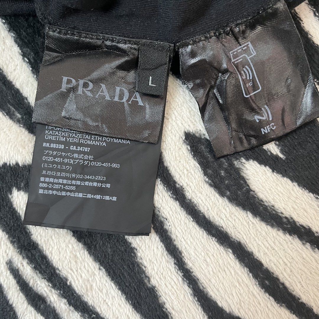 Prada tshirt script design (Category: Luxury Apparel) located in Manila. Submitted by royaldripmanila (Listing ID 1467375416, Image 3). Description: Good condition 9/10 W23 L28.