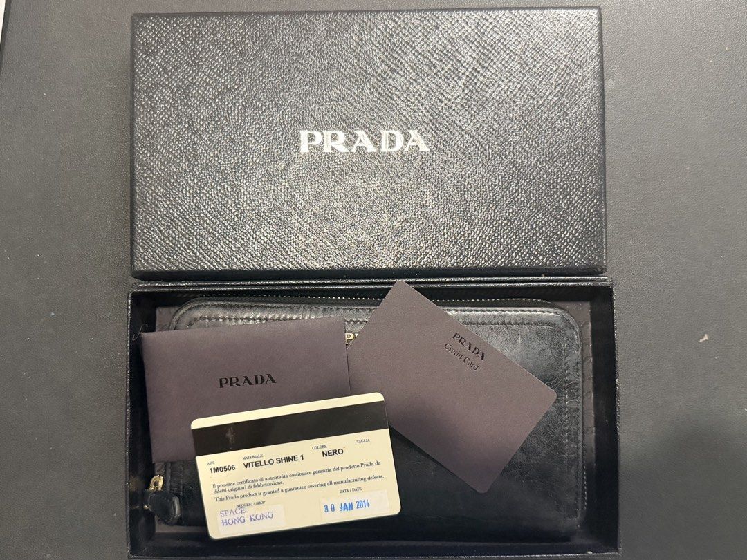 Authentic Prada Vitello Shine Zip Around Wallet Black (Category: Luxury Bags & Wallets) located in Paranaque City. Submitted by silverforest.13 (Listing ID 1467363642, Image 3). Description: - Authentic Prada long zip-around wallet (Model 1M0506) - Material: Luxurious black Vitello Shine leather with gold hardware lettering - Condition: Clean interior and smooth, fully functional zipper - Inclusions: Original box, authenticity card, and store rec